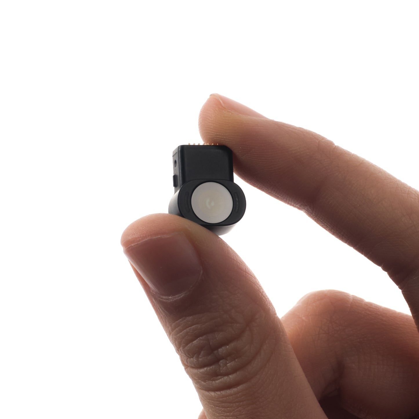 Miniature XREAL Eye camera for AR glasses, shown between fingers to highlight ultra-lightweight design and advanced eye tracking technology
